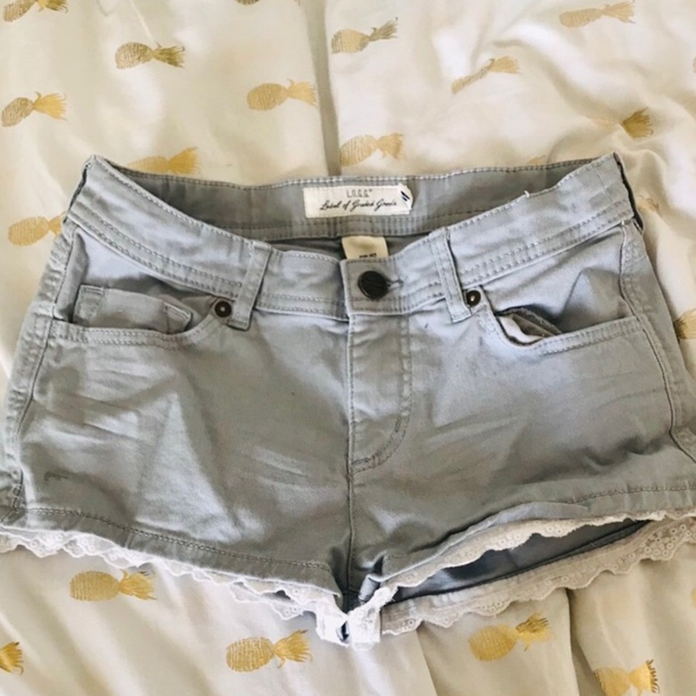 Grey shorts with white lace trim